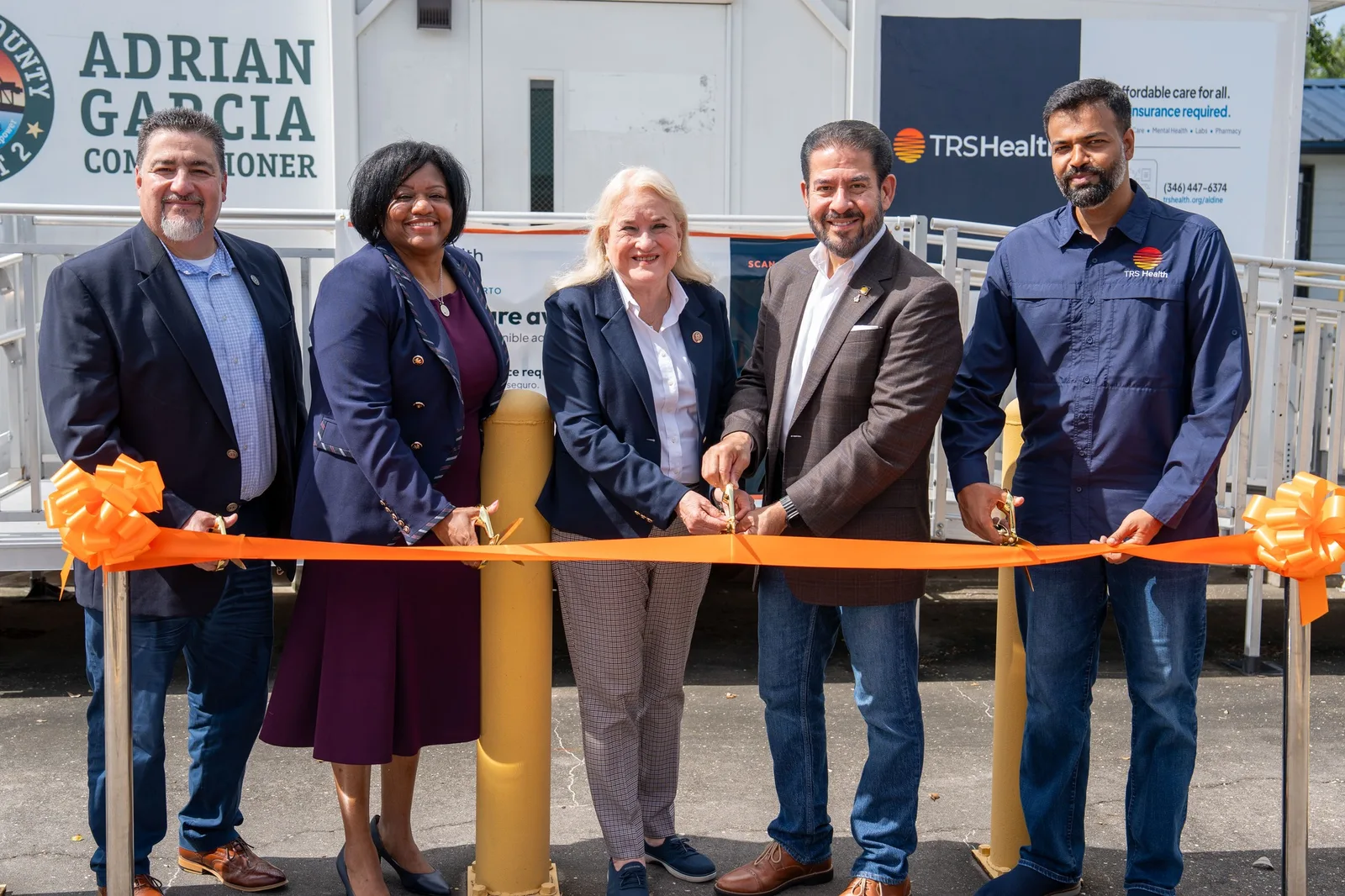 Ribbon cutting at the Access2Health Smart Pod in Aldine with Congresswoman Sylvia Garcia, Commissioner Adrian Garcia, Dr. Chara Bowie, and TRS Health's Shaida Hussain
