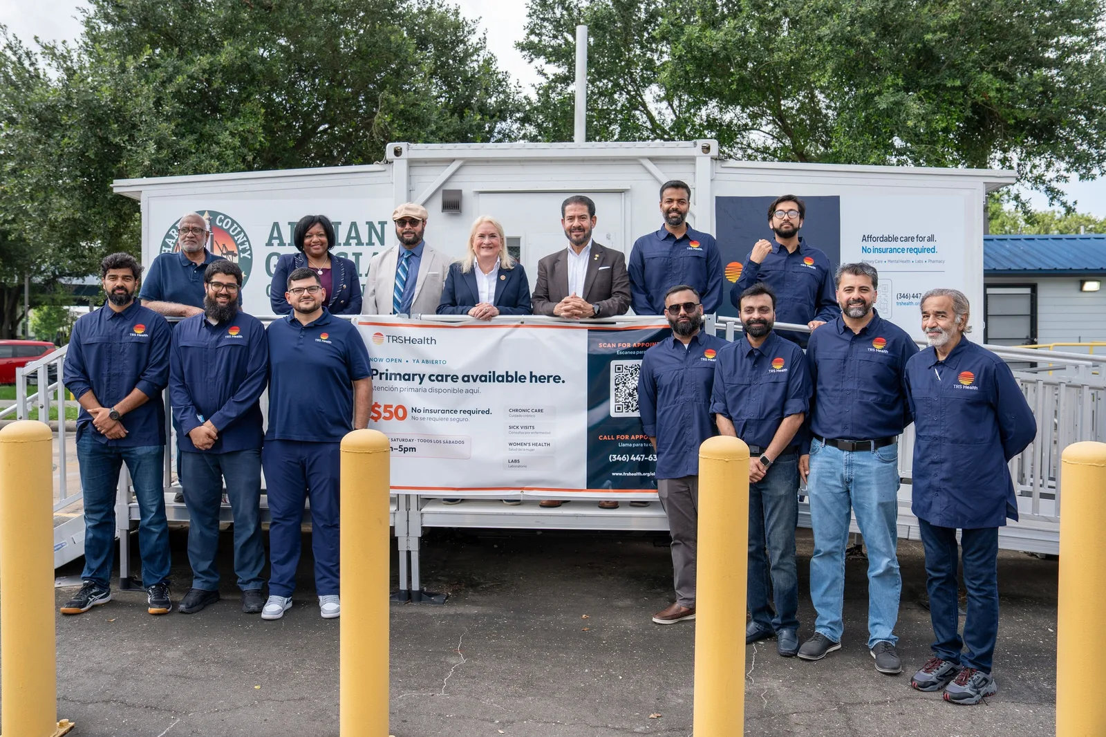 The TRS Health team and volunteers with Congresswoman Sylvia Garcia and Commissioner Adrian Garcia at the Access2Health Smart Pod